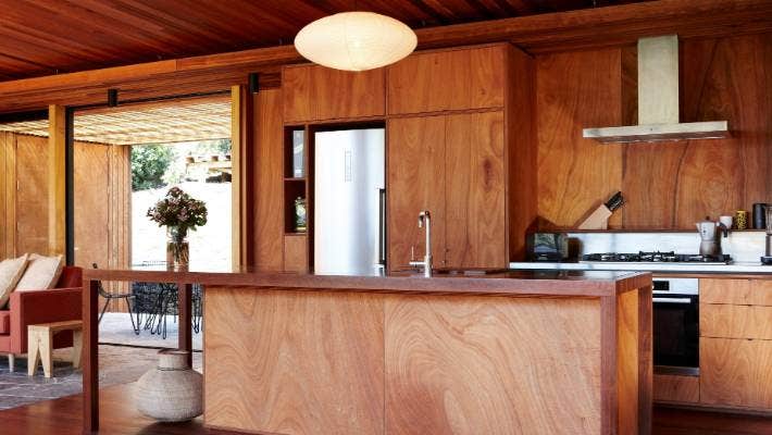 A kitchen panelled with okoume plywood