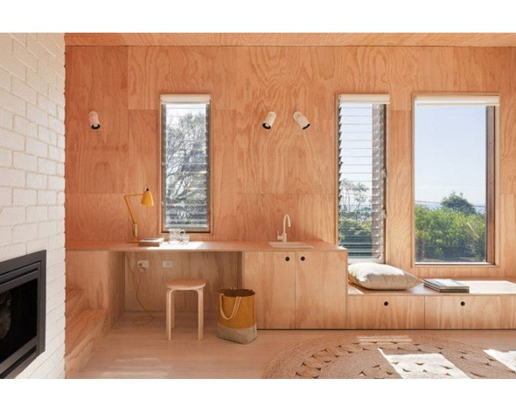 A house interior wall panelled with okoume plywood